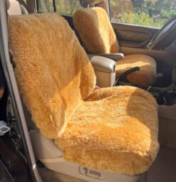 interior of a car with sheepskin seat covers. The covers are a light brown color