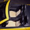 interior of a yellow convertible car with sheepskin seat covers