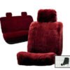 a set of sheepskin seat covers for a car. The covers are a deep red color